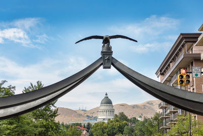 Low angle view of sculpture against sky