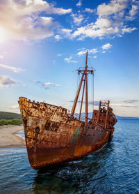 Sailboat on sea against sky