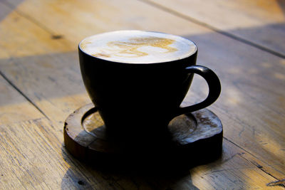 Close-up of cappuccino on table