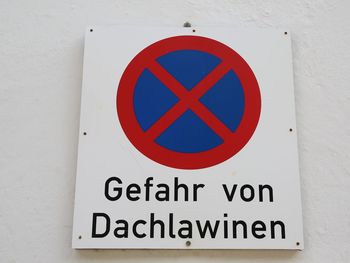 Close-up of warning sign on wall