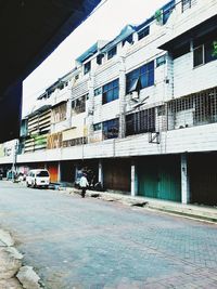 Street by buildings in city