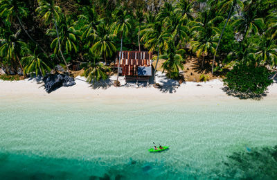 Drone view of couple at beach on sunny day