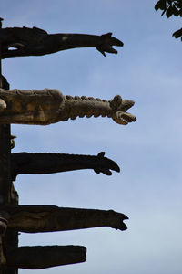 Low angle view of statue against sky