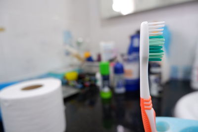 Close-up of toothbrush in bathroom