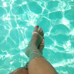 Low section of woman in swimming pool