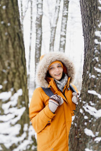 Portrait of a smiling young woman in winter