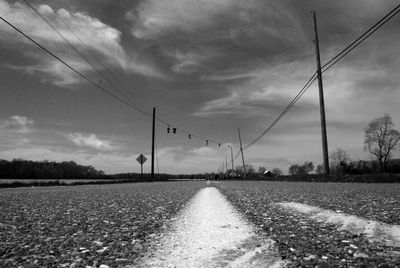 View of railroad track against cloudy sky