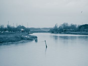 Scenic view of frozen lake against sky