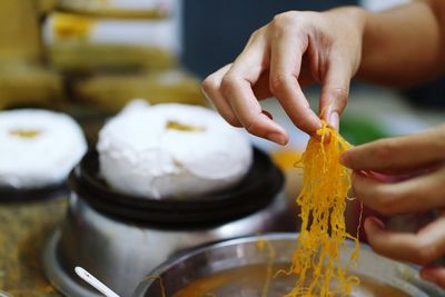 Close-up of person preparing food