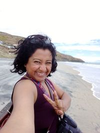 Portrait of a smiling young woman on beach