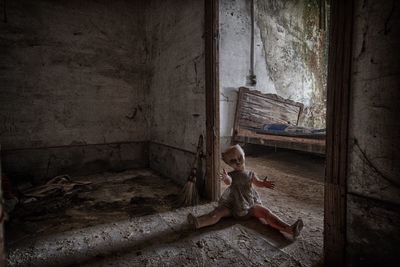 Weathered doll in abandoned house