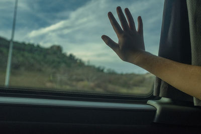 Man seen through glass window