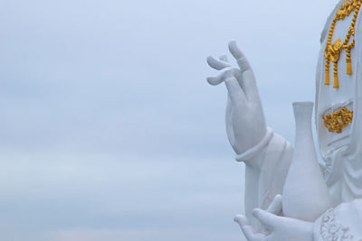 Low angle view of statue against sky