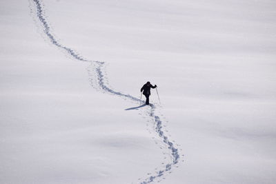 Full length of person on snow field during winter