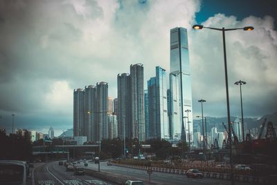 City skyline against cloudy sky