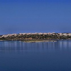 Scenic view of calm sea against clear sky