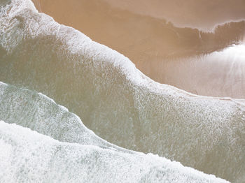 High angle view of water flowing in winter