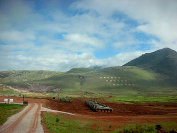 Scenic view of military base by land against sky in china