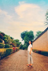 Rear view of man standing against sky