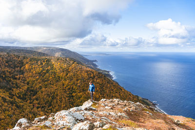 Man hiking blueberry mountain, cape breton island, nova scotia, canada