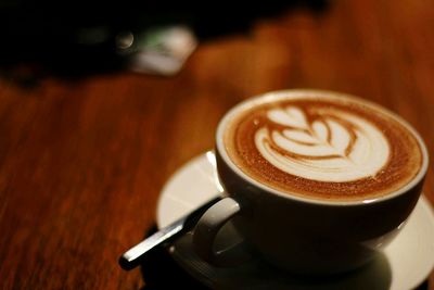 Close-up of cappuccino on table