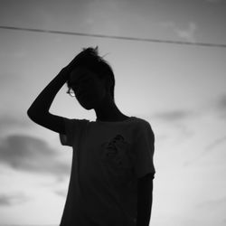 Woman standing against sky