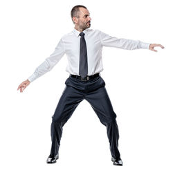 Portrait of young man standing against white background