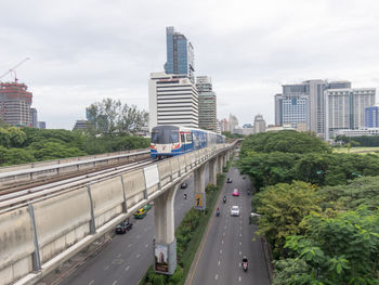 Panoramic view of city street against sky