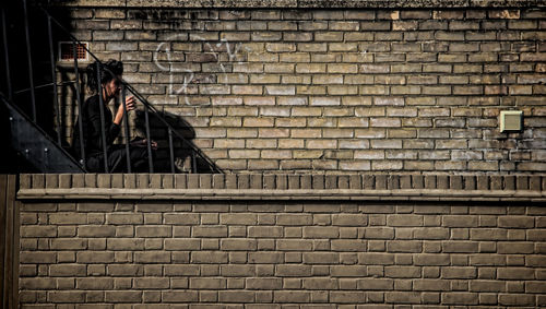 People sitting on wall