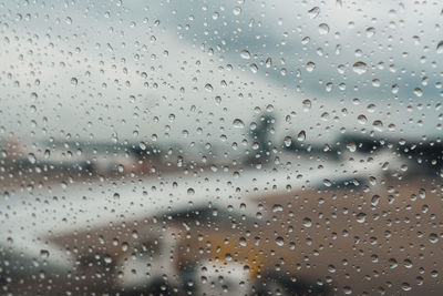 Full frame shot of raindrops on glass window