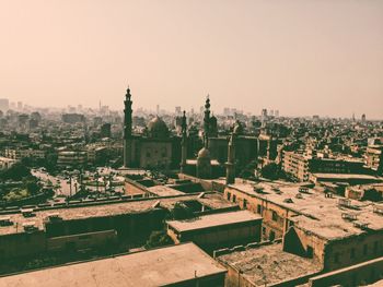 High angle view of buildings in city against clear sky