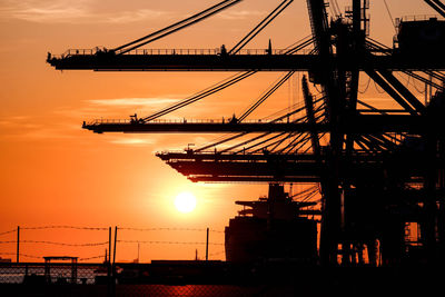 Silhouette of bridge against sky during sunset