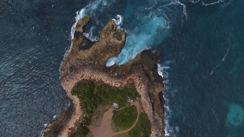 High angle view of rock formation in sea