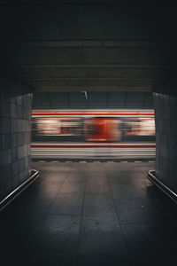 Blurred motion of train at railroad station