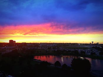 Silhouette of city at sunset