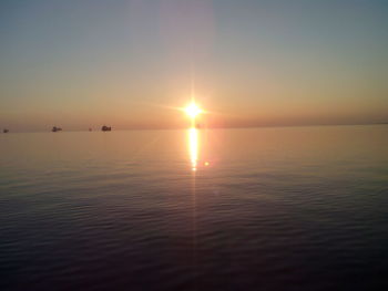 Scenic view of sea at sunset