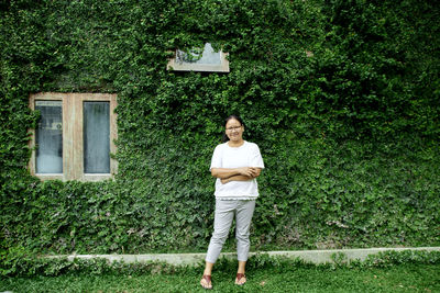 Portrait of smiling man standing on grass