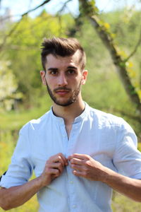 Portrait of young man at park