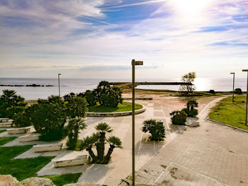 Scenic view of swimming pool by sea against sky