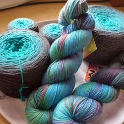 Skeins and cakes of hand dyed yarn
