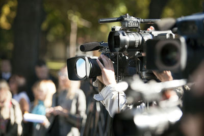 Close-up of person photographing through camera