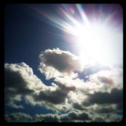 Sun shining through clouds