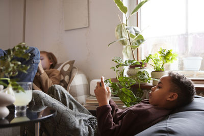 Children playing video games at home