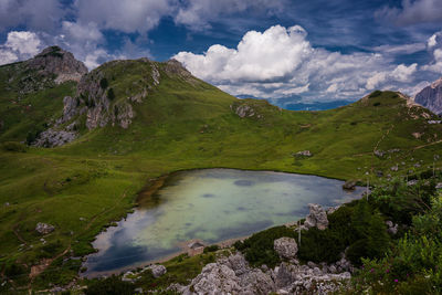 Scenic view of lake and mountains against sky