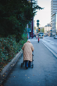 Rear view of two women walking on street