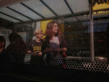 Man seen through blinds