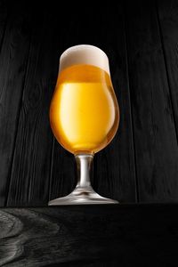 Close-up of beer glass on table