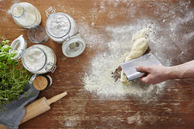 High angle view of hands on table