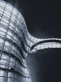 Low angle view of glass building against sky