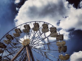 Low angle view of ferris wheel against sky